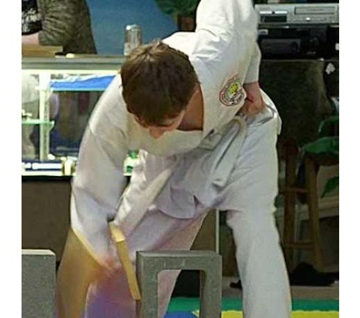 Mr. Auston breaks a board for Yellow belt